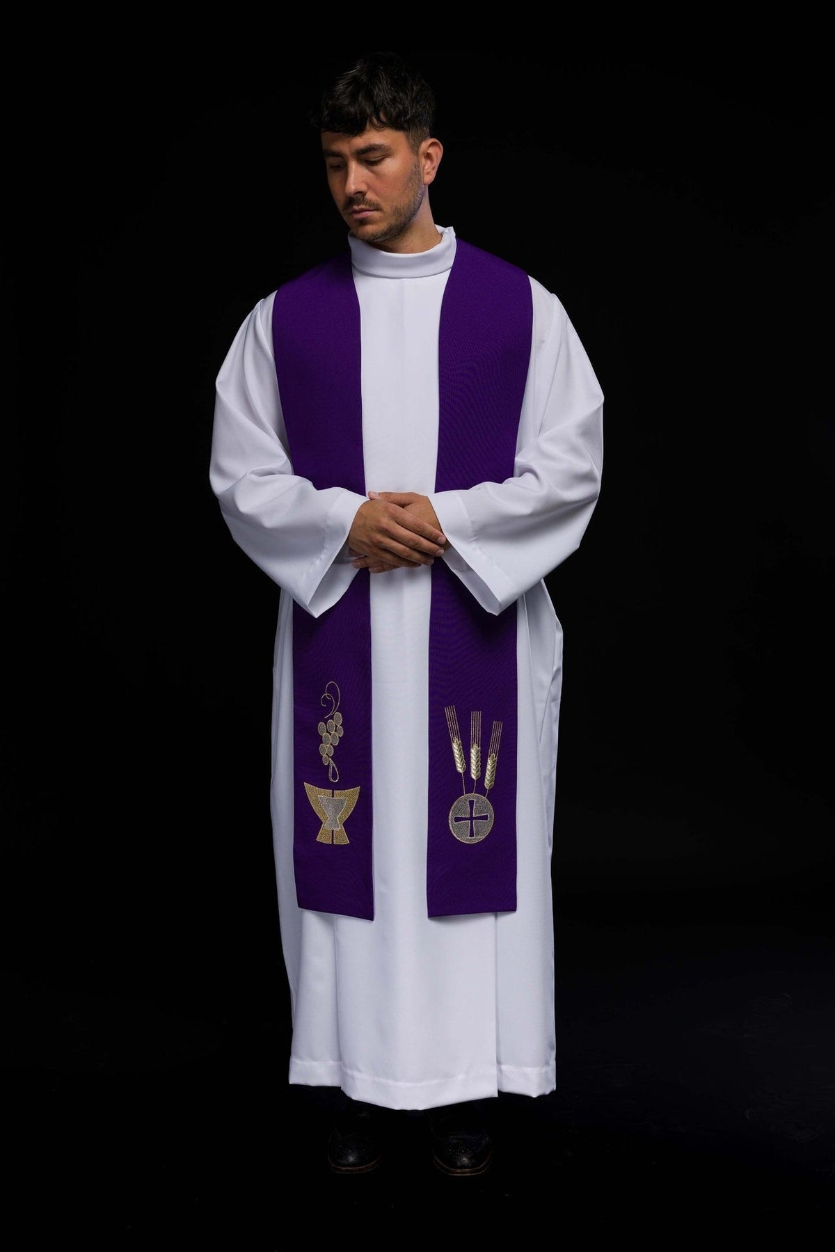 Purple embroidered stole front view worn with chalice, wheat and grapes