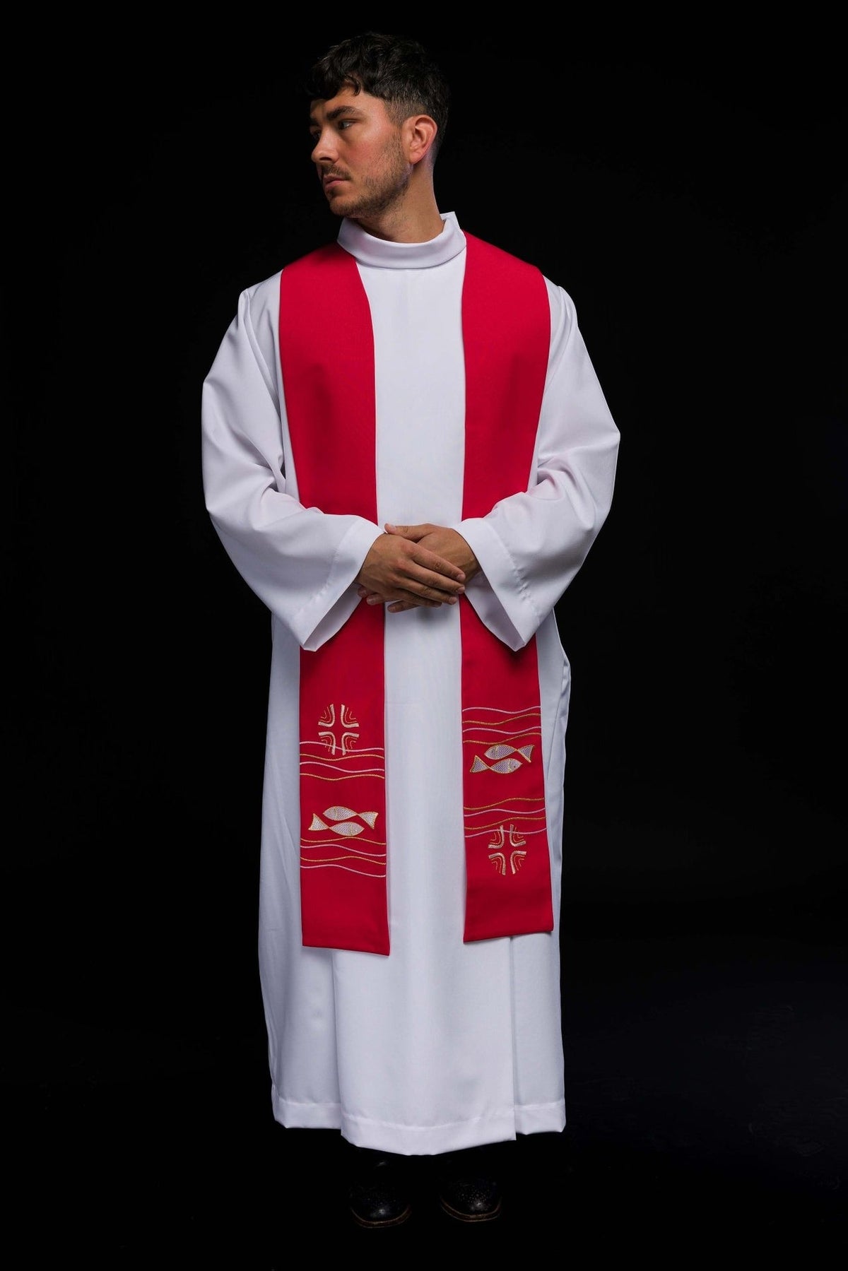 Embroidered red stole worn in front view with fish and cross motifs