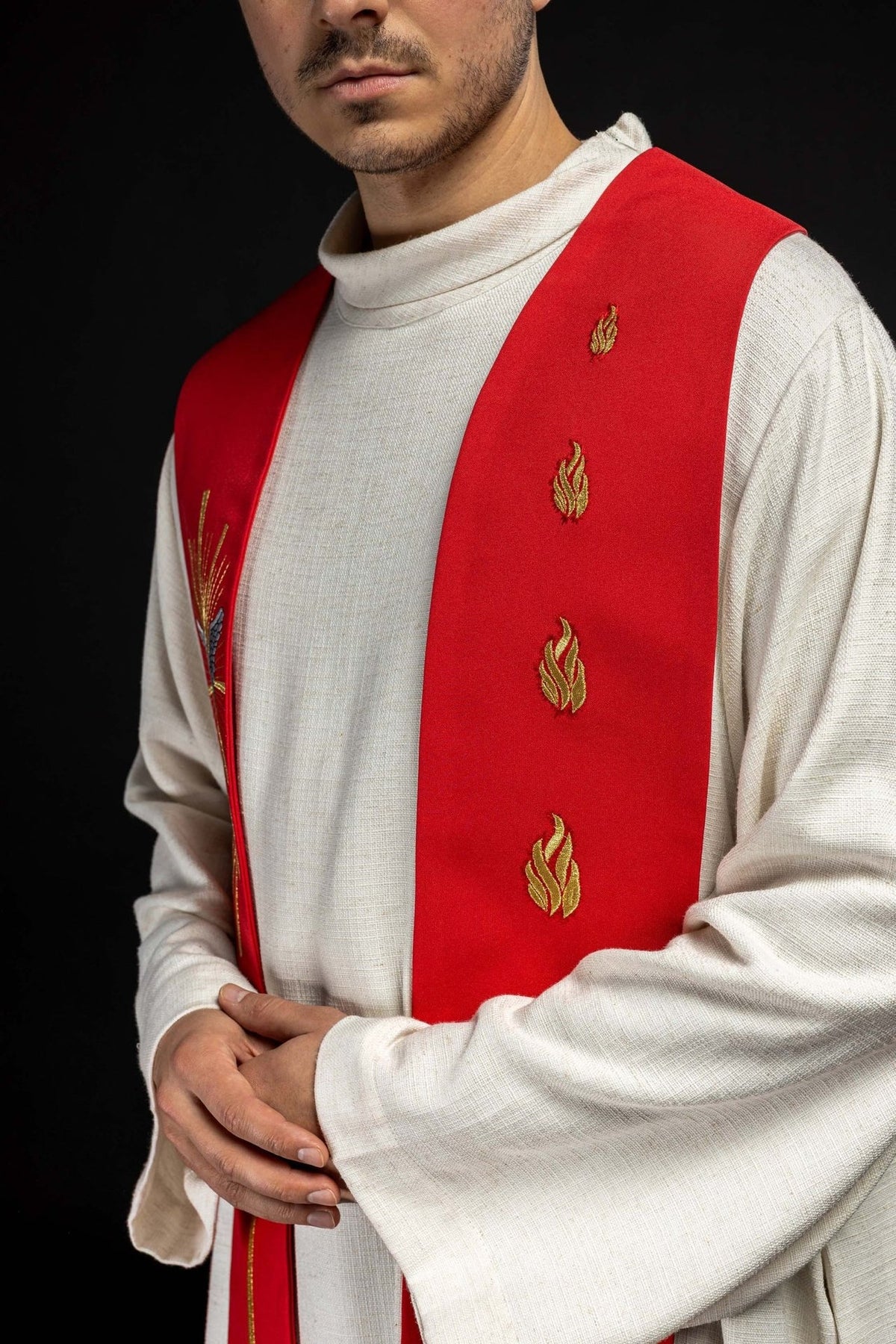 Red stole side view worn with embroidered fiery tongues