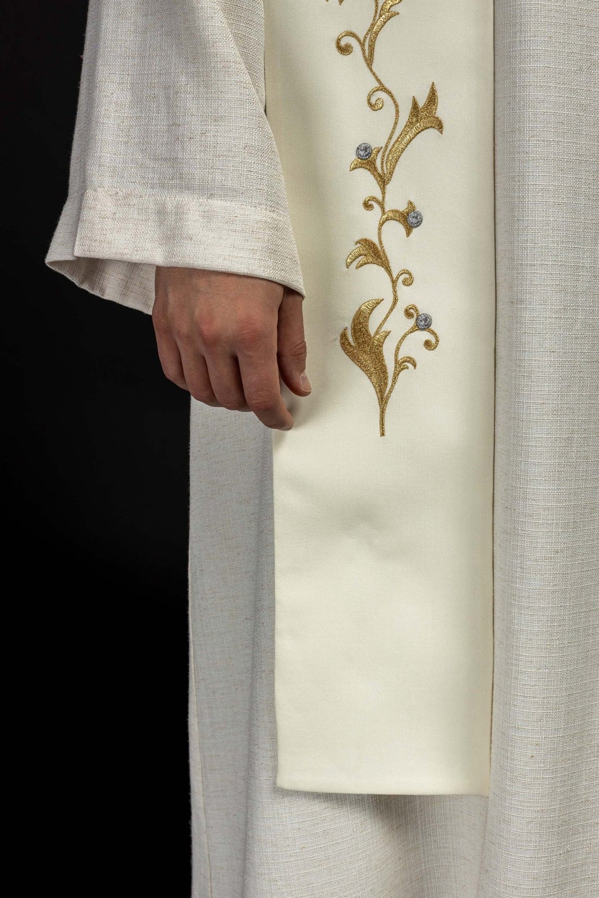 Embroidered stole close-up showing the lower gold floral embroidery and silver accents