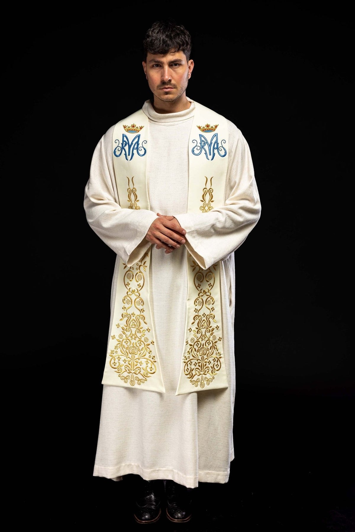 Ecru stole worn front view showing full-length gold embroidery and crowned Marian symbols