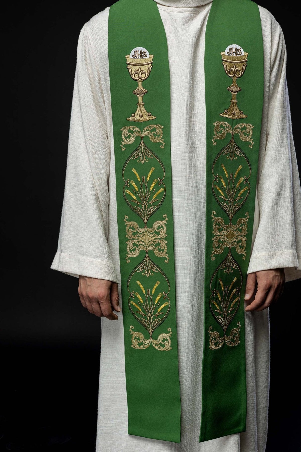 Green priest stole worn from the front with repeated gold embroidery
