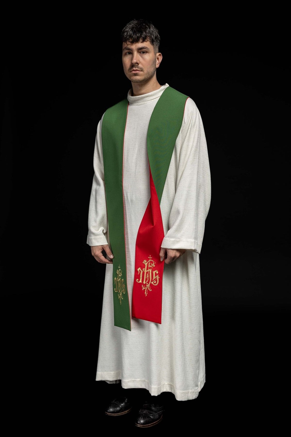 IHS stole worn at an angle, showing green and red sides with gold embroidery