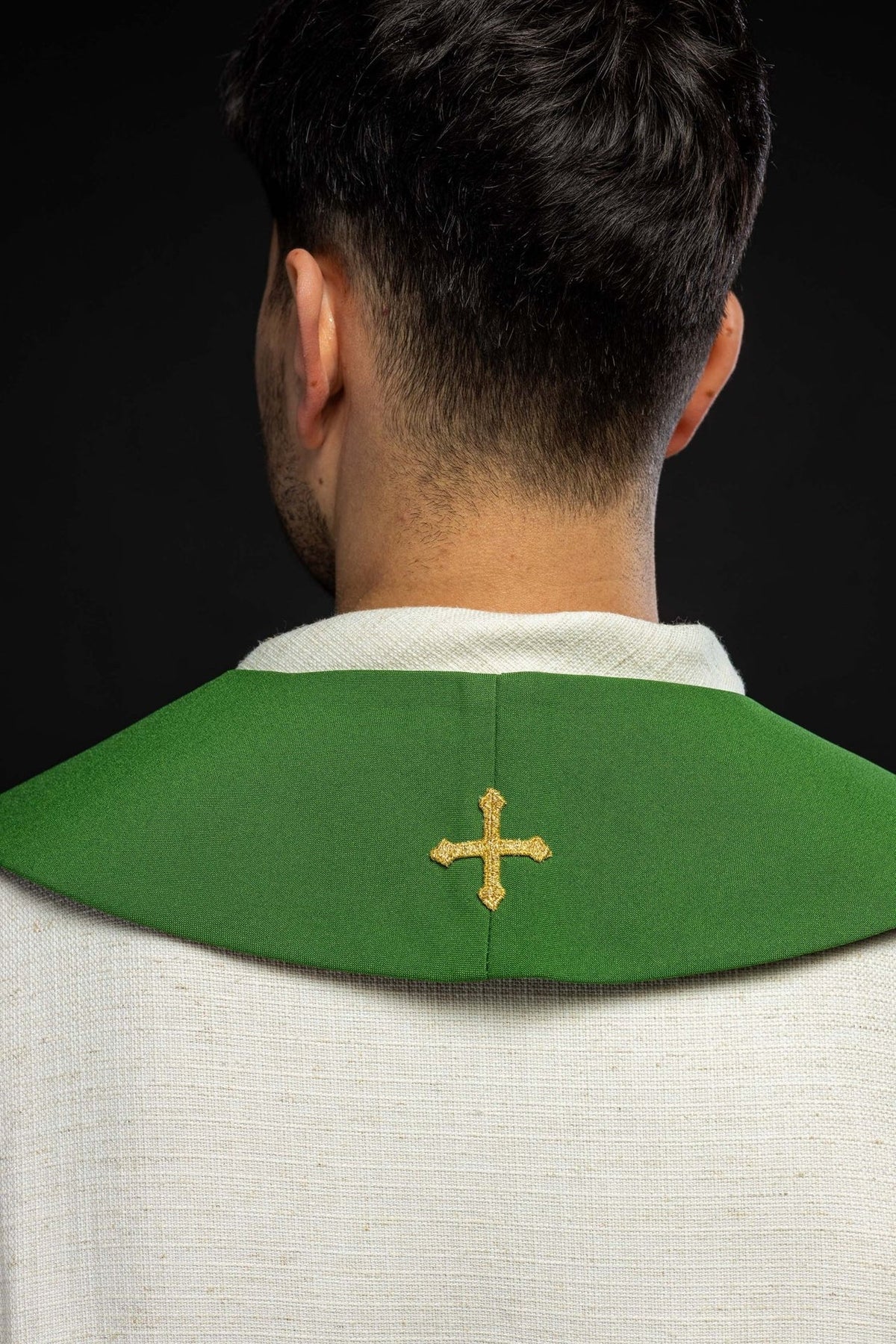 Green stole back view worn with a small gold cross embroidery