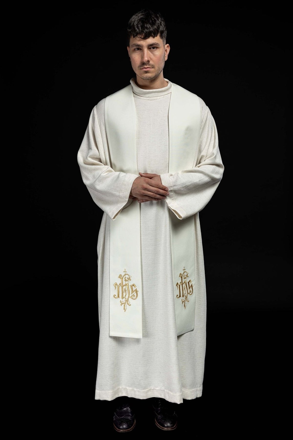 IHS stole worn front view with white fabric and gold embroidery