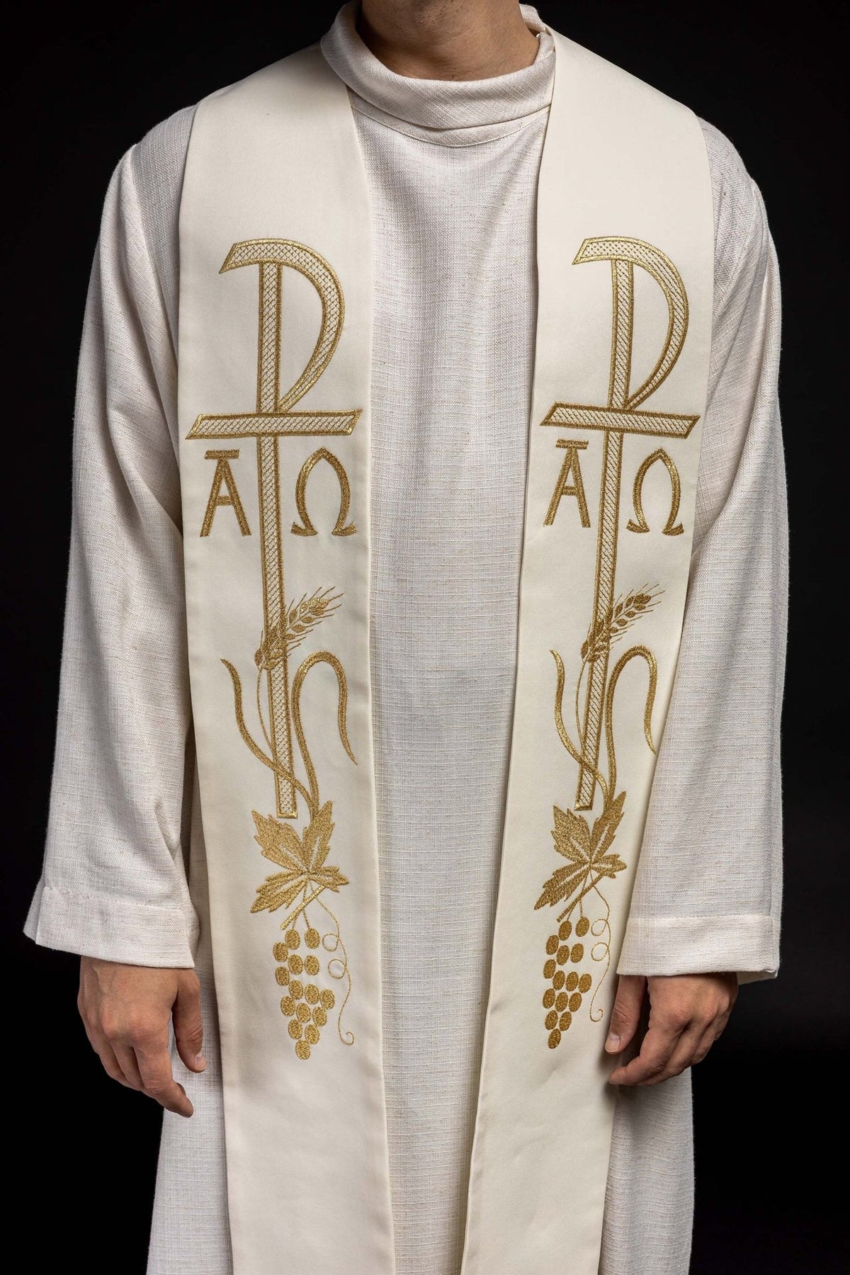 Ecru priest stole close-up showing embroidered cross and Alpha Omega symbols