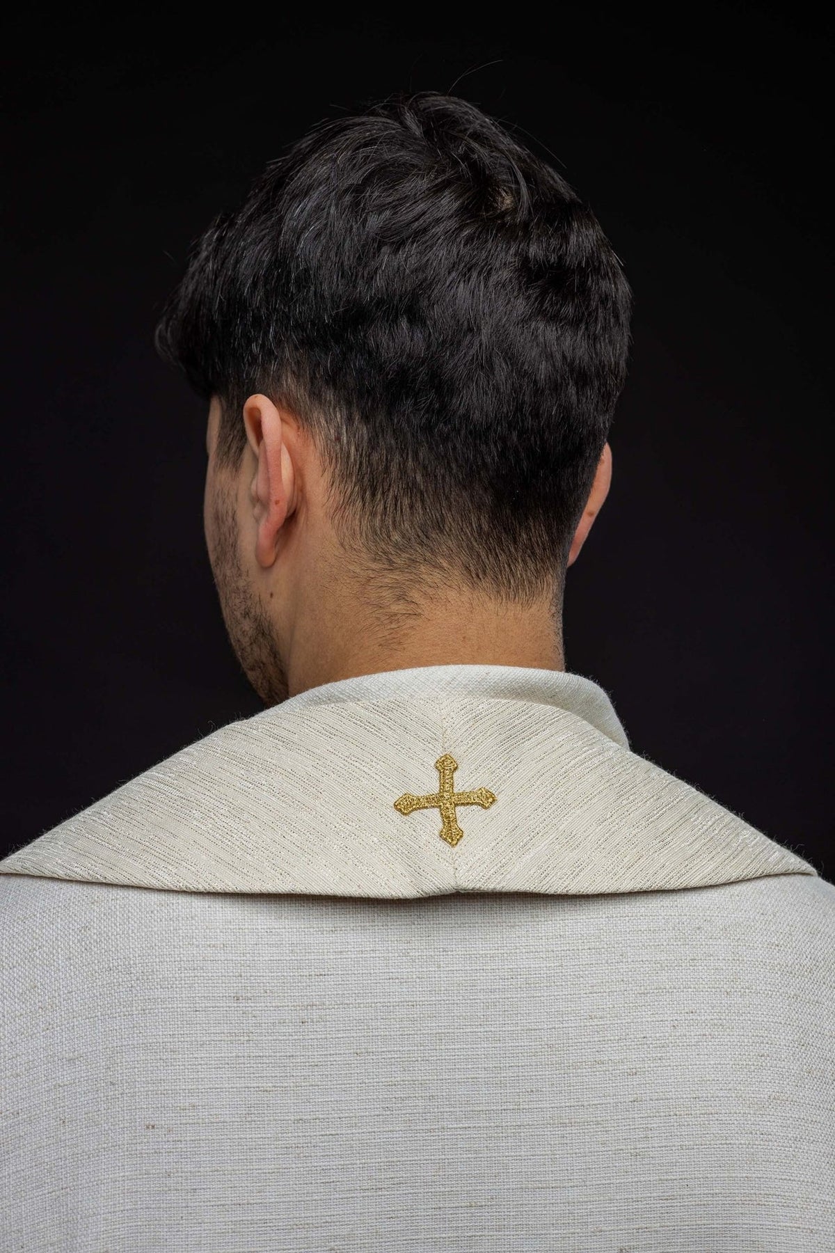Stole back view with a small gold embroidered cross at the neck