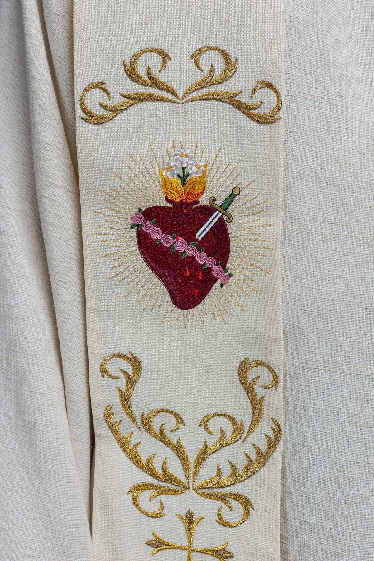 Stole close-up showing embroidered Sacred Heart of Mary and gold scrollwork