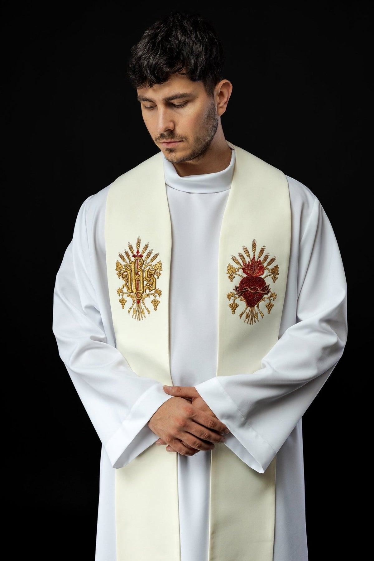 Ecru priest stole worn, showing IHS and Sacred Heart of Jesus embroidery