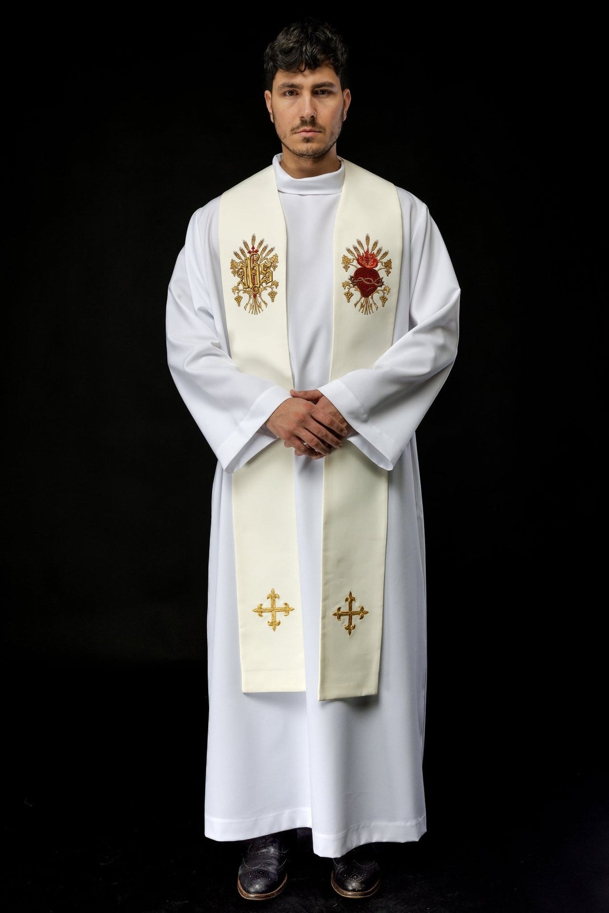 Ecru priest stole worn in front view, showing both embroidered motifs and lower crosses