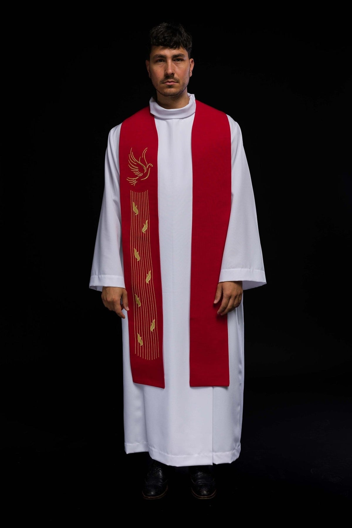 Red embroidered stole worn from the front with Holy Spirit dove and feather motifs