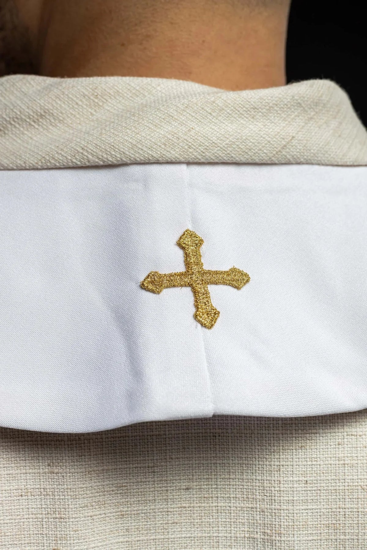 White wedding stole close-up showing gold text and two dove embroidery