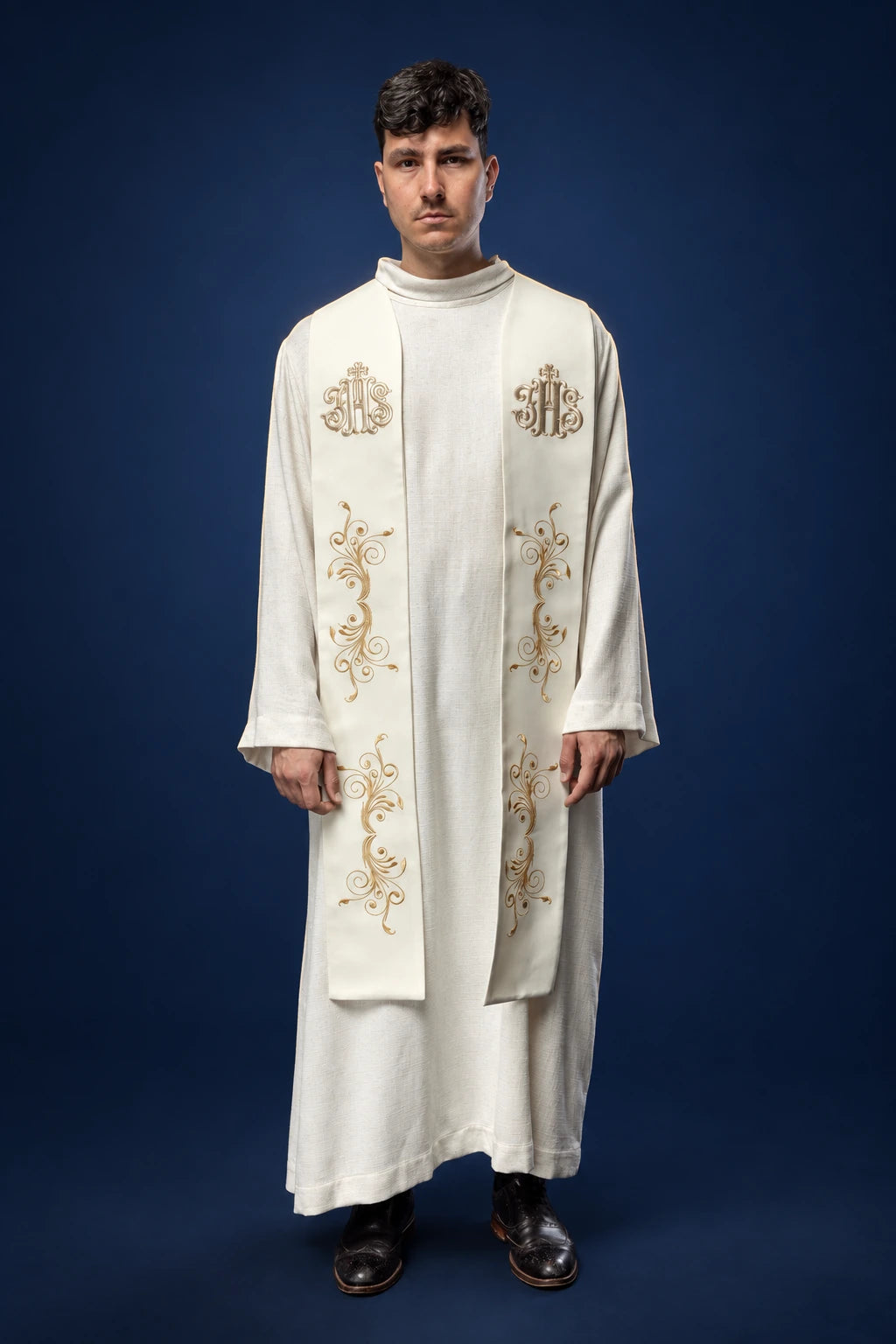 Embroidered Ecru Stole with IHS worn front view, with gold IHS and scroll embroidery
