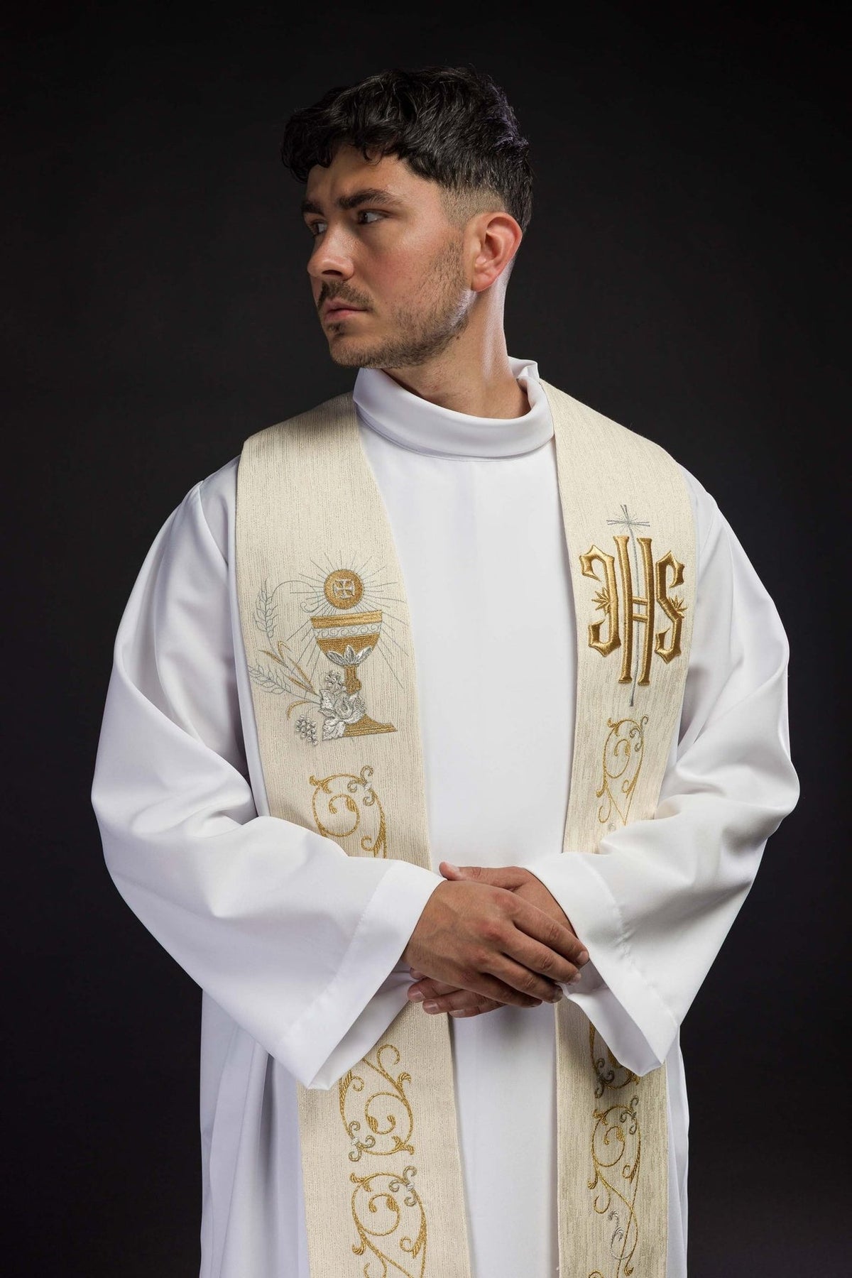 Ecru priest stole worn close-up showing IHS, chalice and scroll embroidery