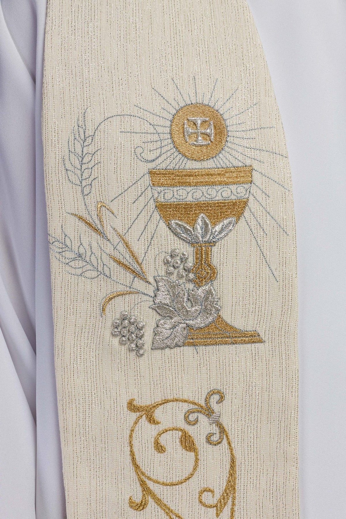 Ecru priest stole close-up showing embroidered chalice and IHS motif