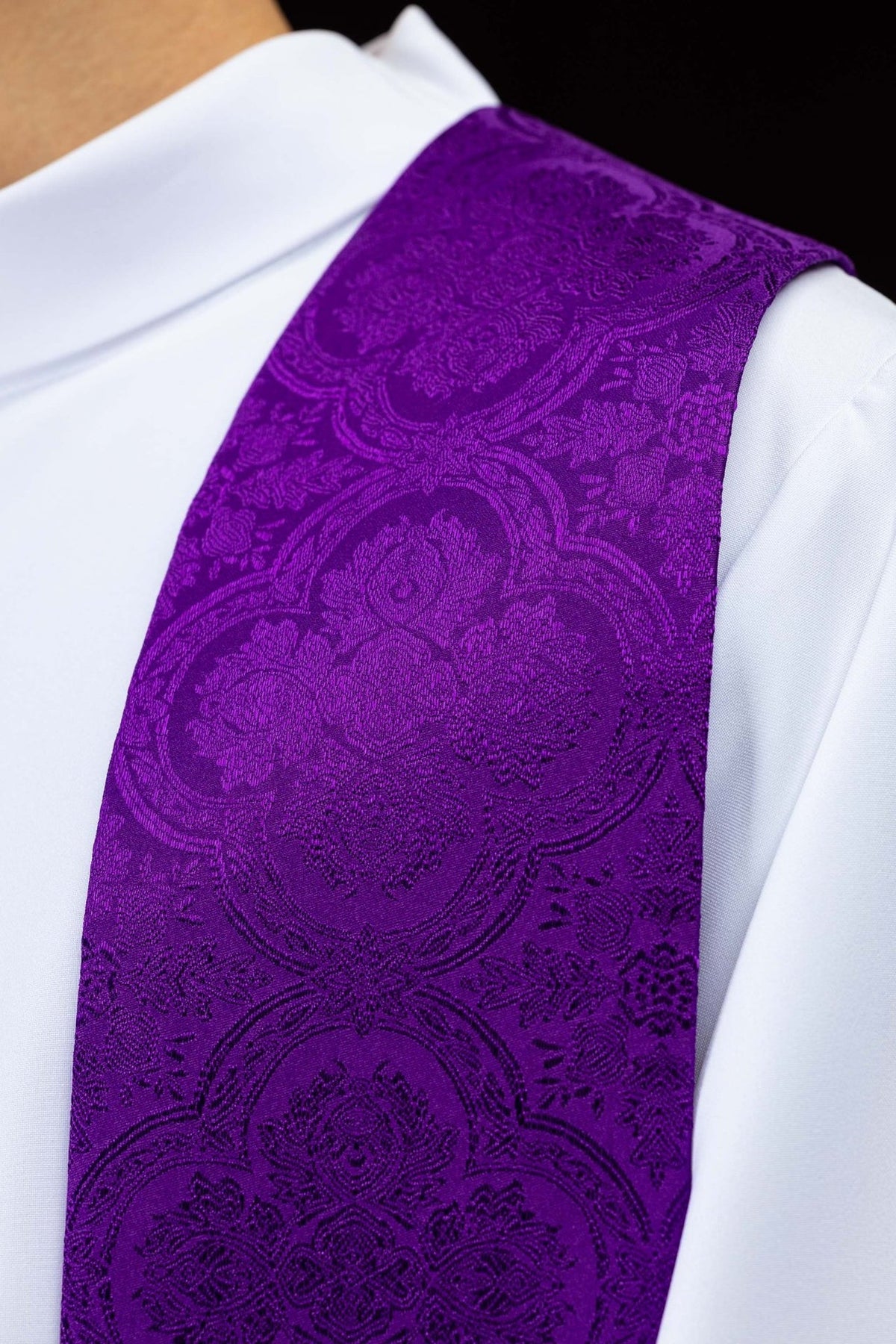 Purple priest stole close-up showing embroidered jacquard fabric