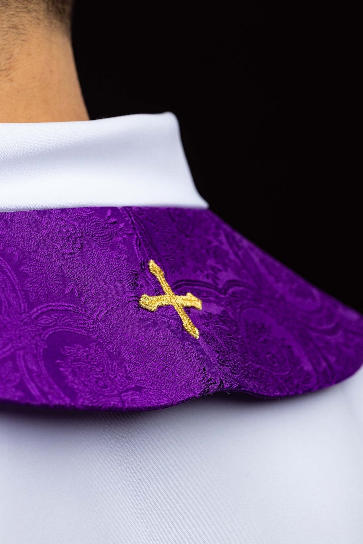 Purple priest stole side close-up with small gold cross embroidery