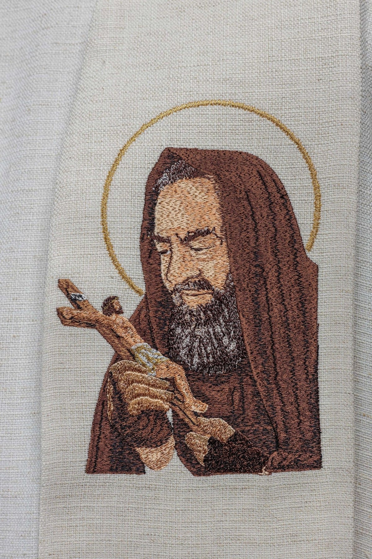 Padre Pio stole close-up showing the embroidered portrait with gold halo