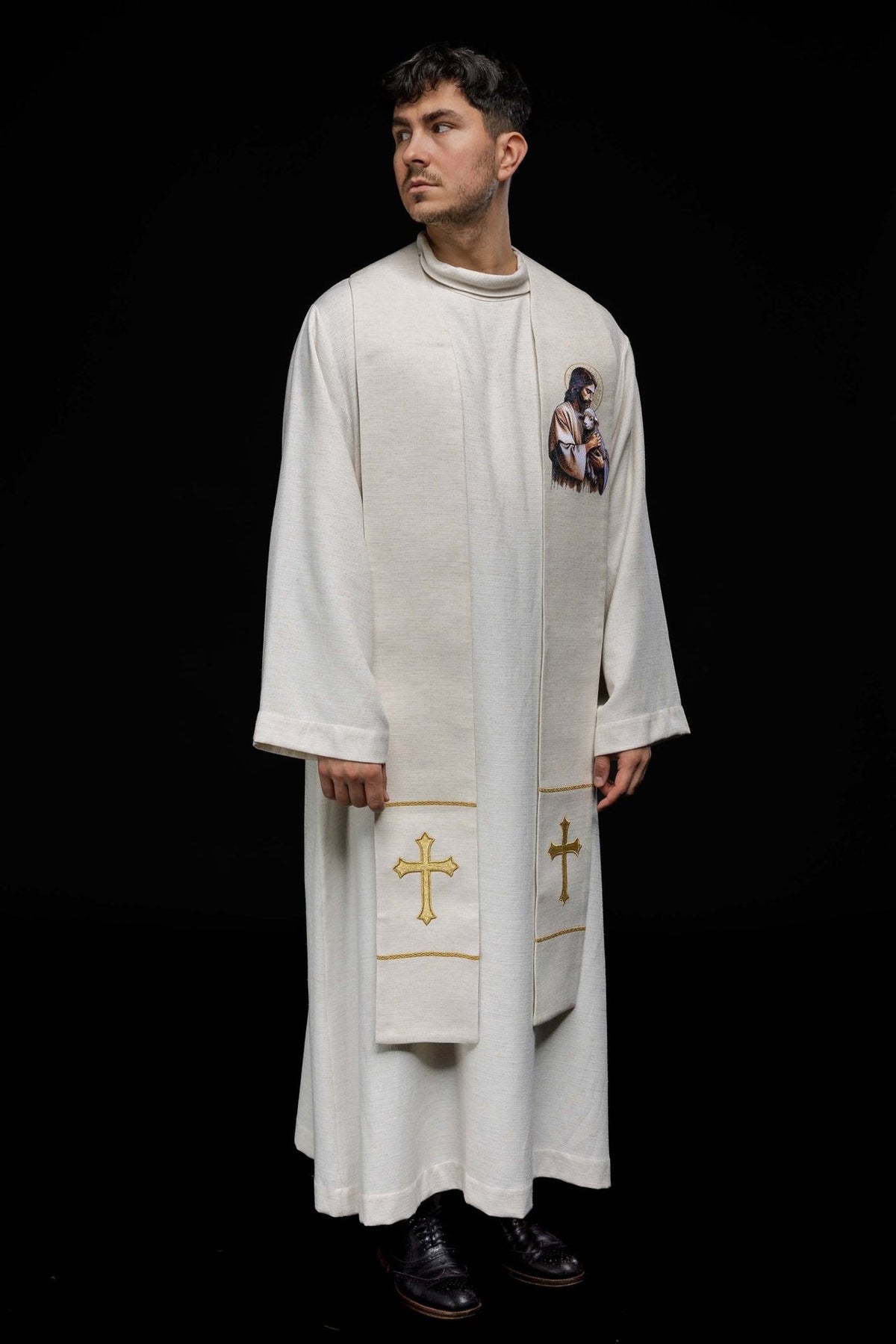 Good Shepherd stole worn at an angle, showing the front embroidery and gold crosses