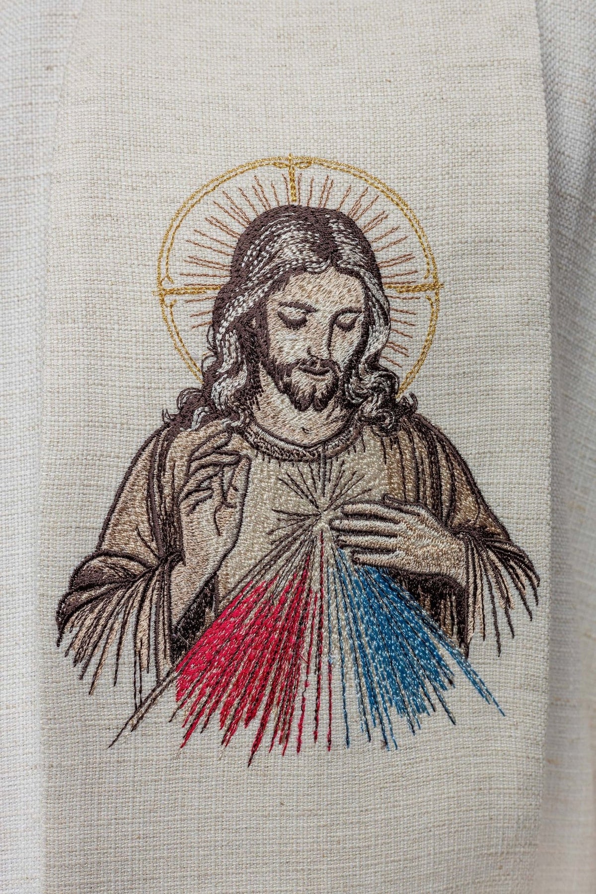 Divine Mercy stole close-up showing embroidered Jesus with red and blue rays