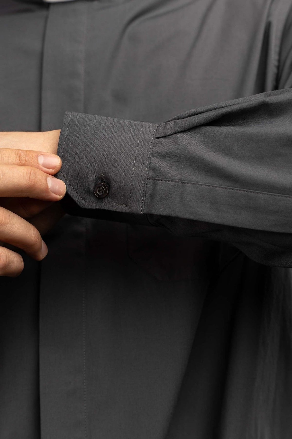 Clergy shirt close-up showing the pointed chest pocket and stitching