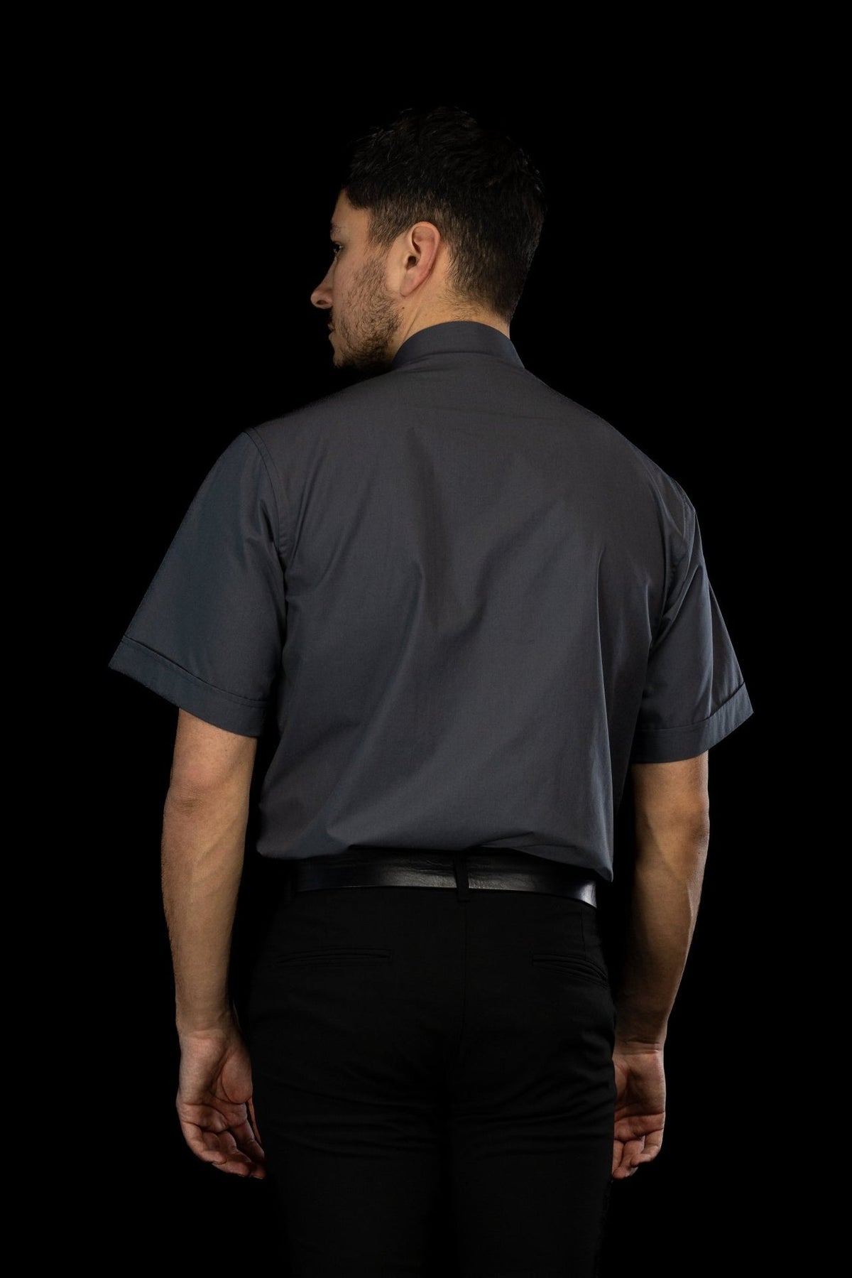 Clergy shirt back view in dark gray with short sleeves