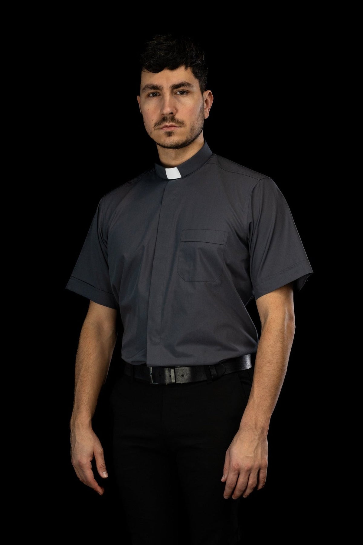 Dark gray clergy shirt front view with clerical collar and chest pocket