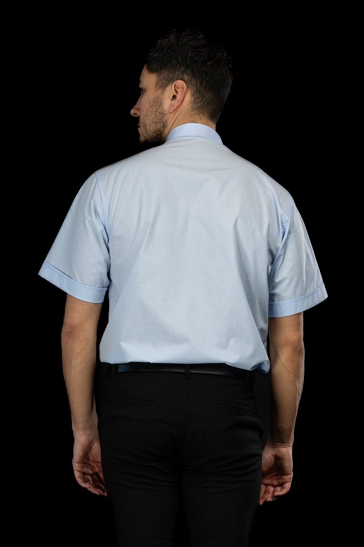 Light blue clergy shirt back view with short sleeves