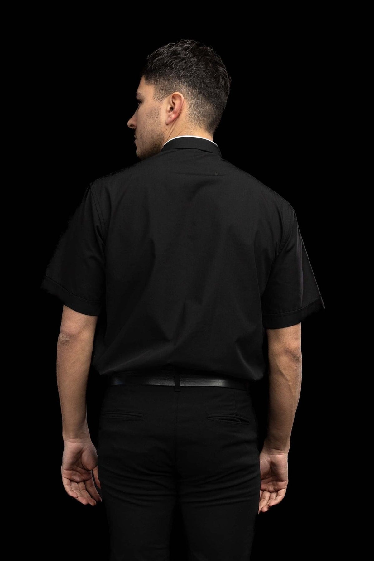 Black clergy shirt worn from the back