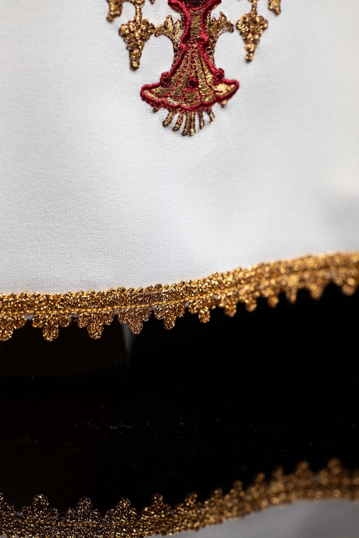 Chalice veil close-up showing ornate gold embroidered trim