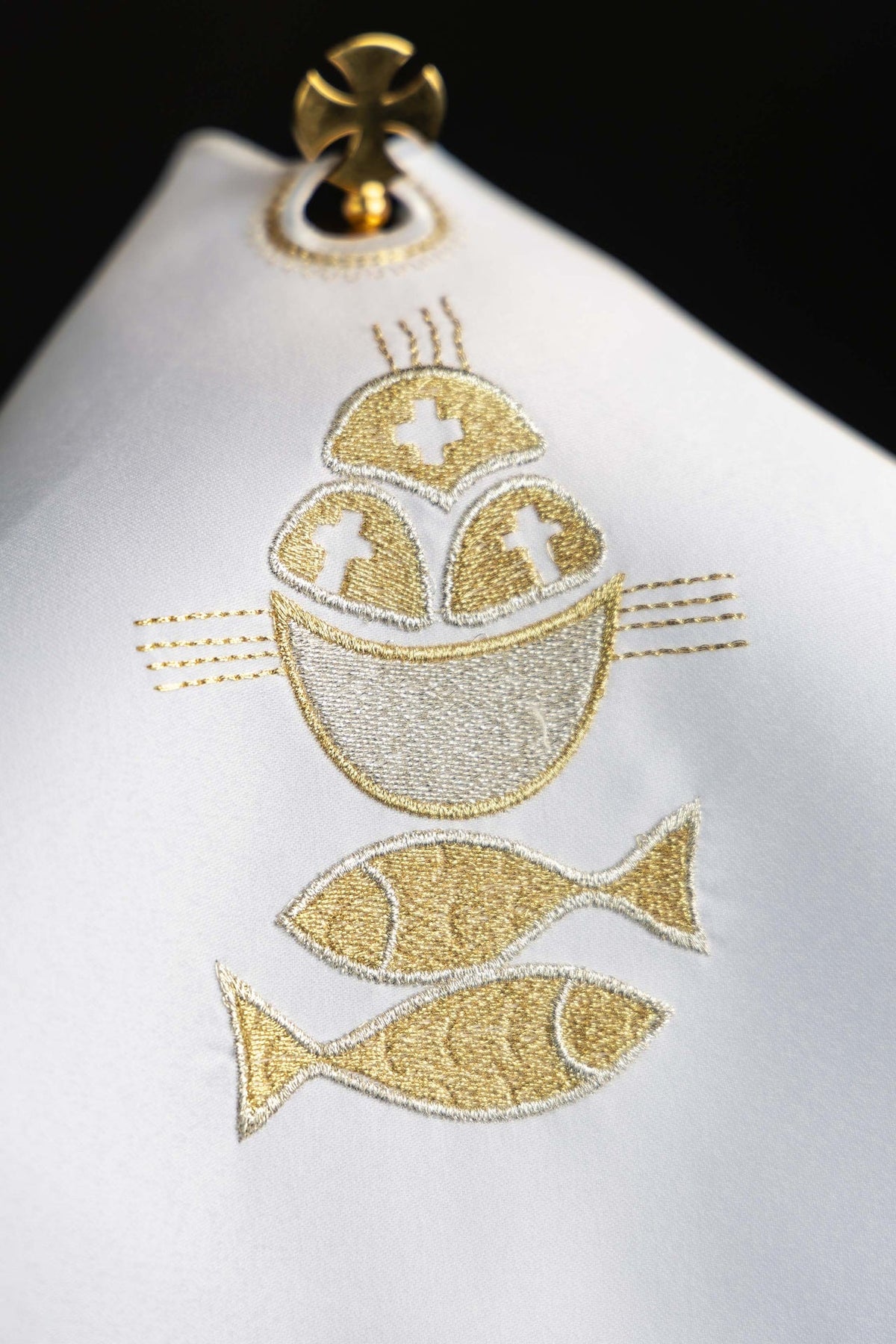 Ciborium veil close-up showing gold bread, fish and chalice embroidery