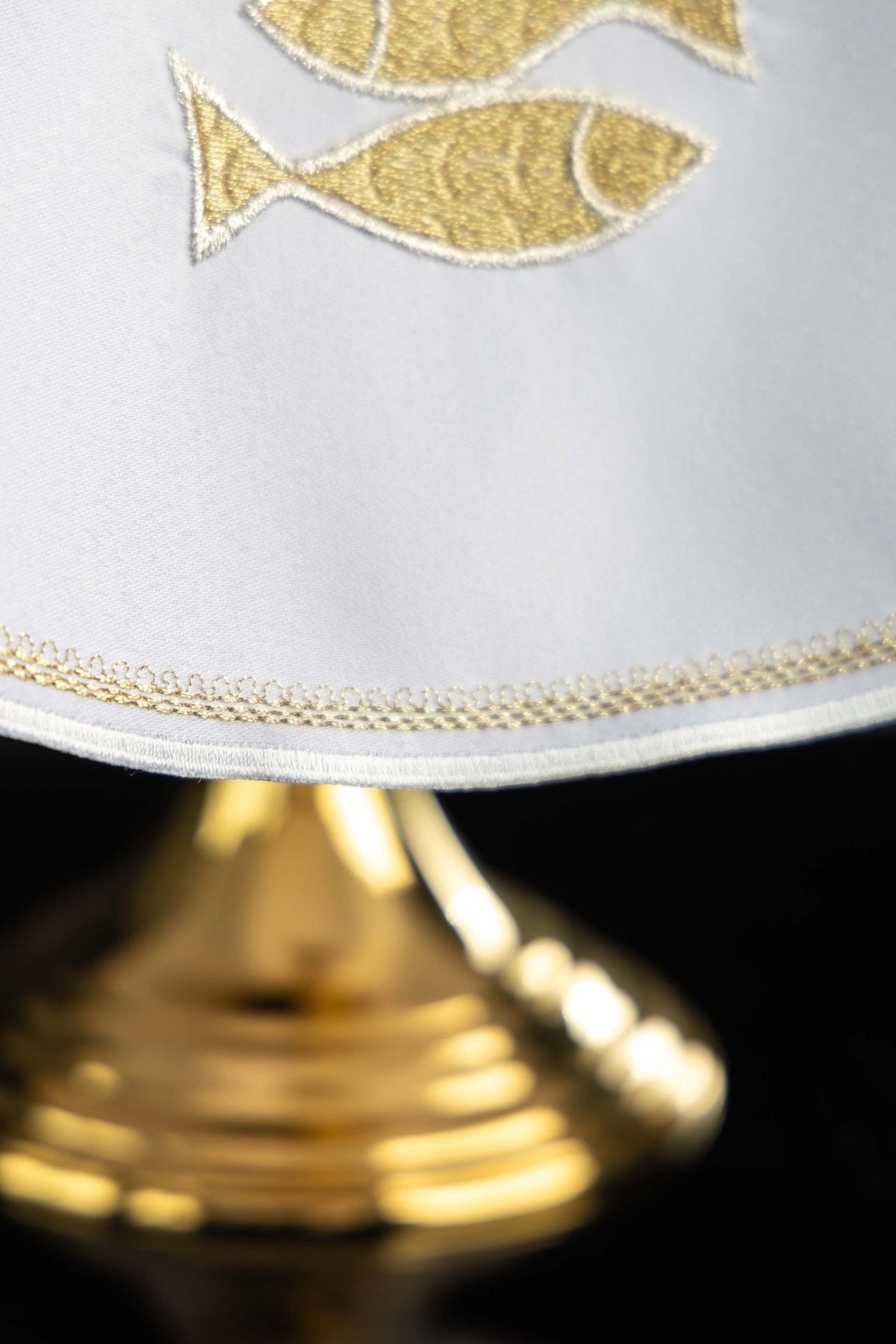 Ciborium veil close-up of gold embroidered fish and decorative edging