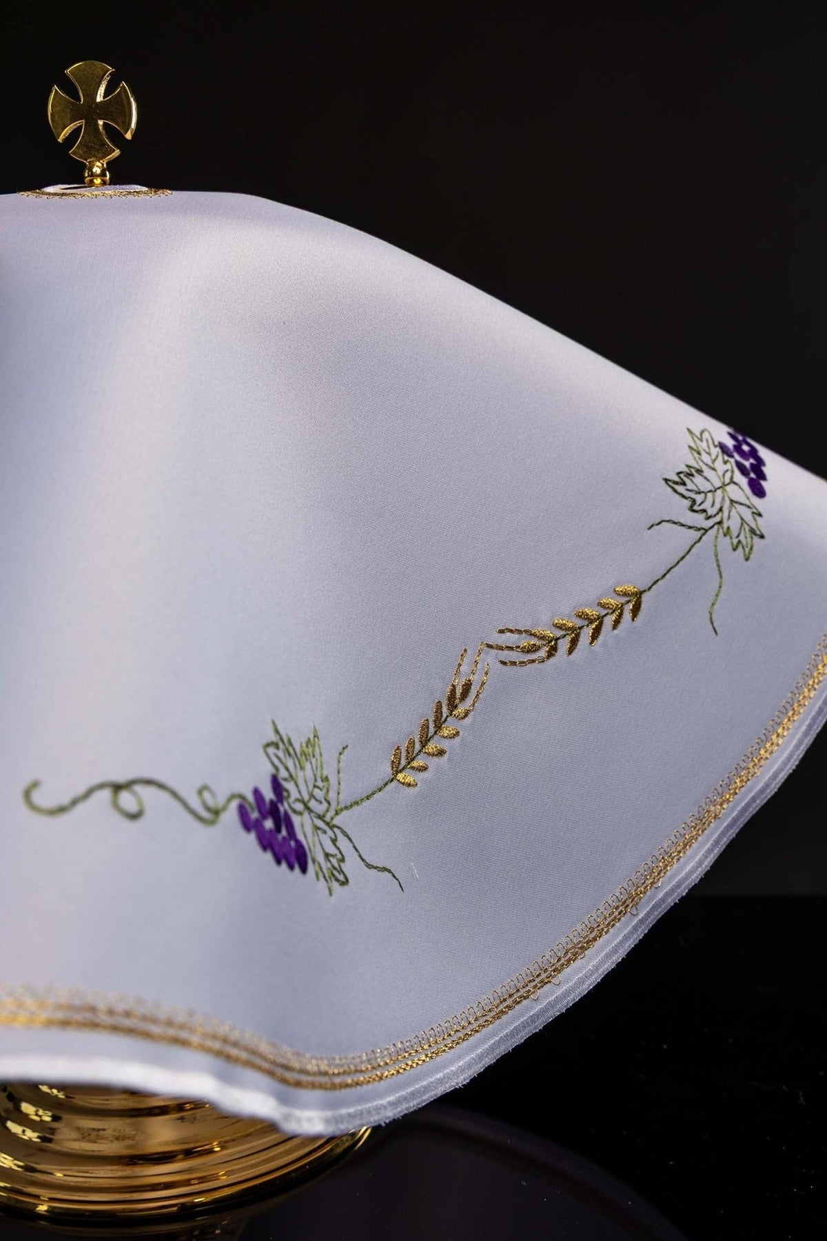 White ciborium veil side view with gold edging and grape and wheat embroidery