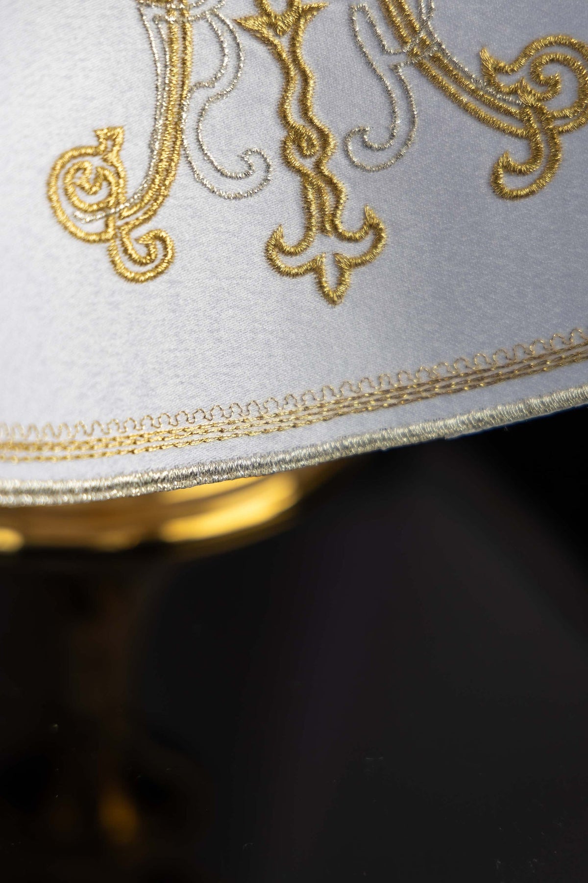 Ciborium veil detail showing gold and silver embroidery with ornate edge trim