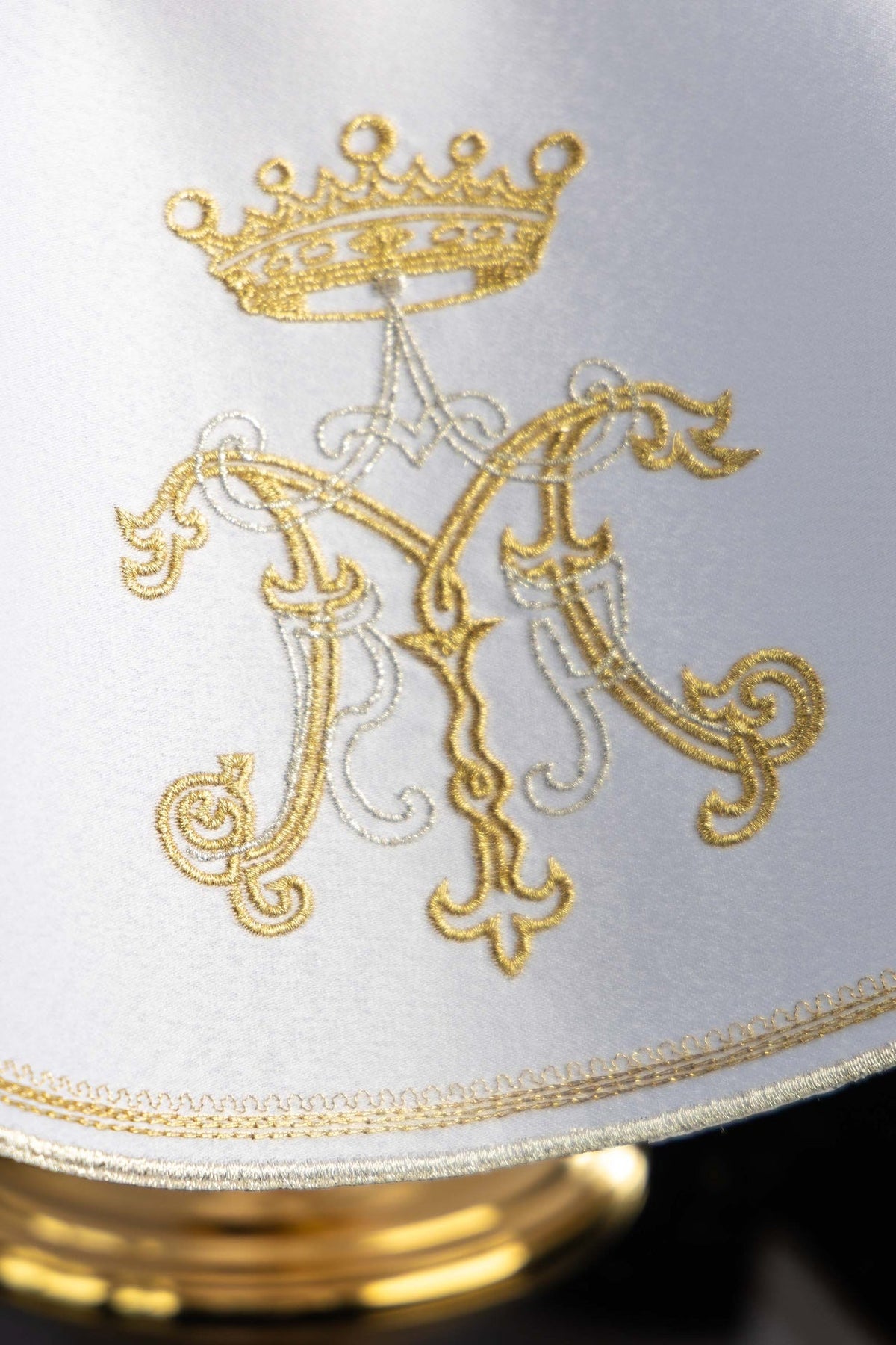 Ciborium veil close-up of gold and silver Marian embroidery and layered edge trim
