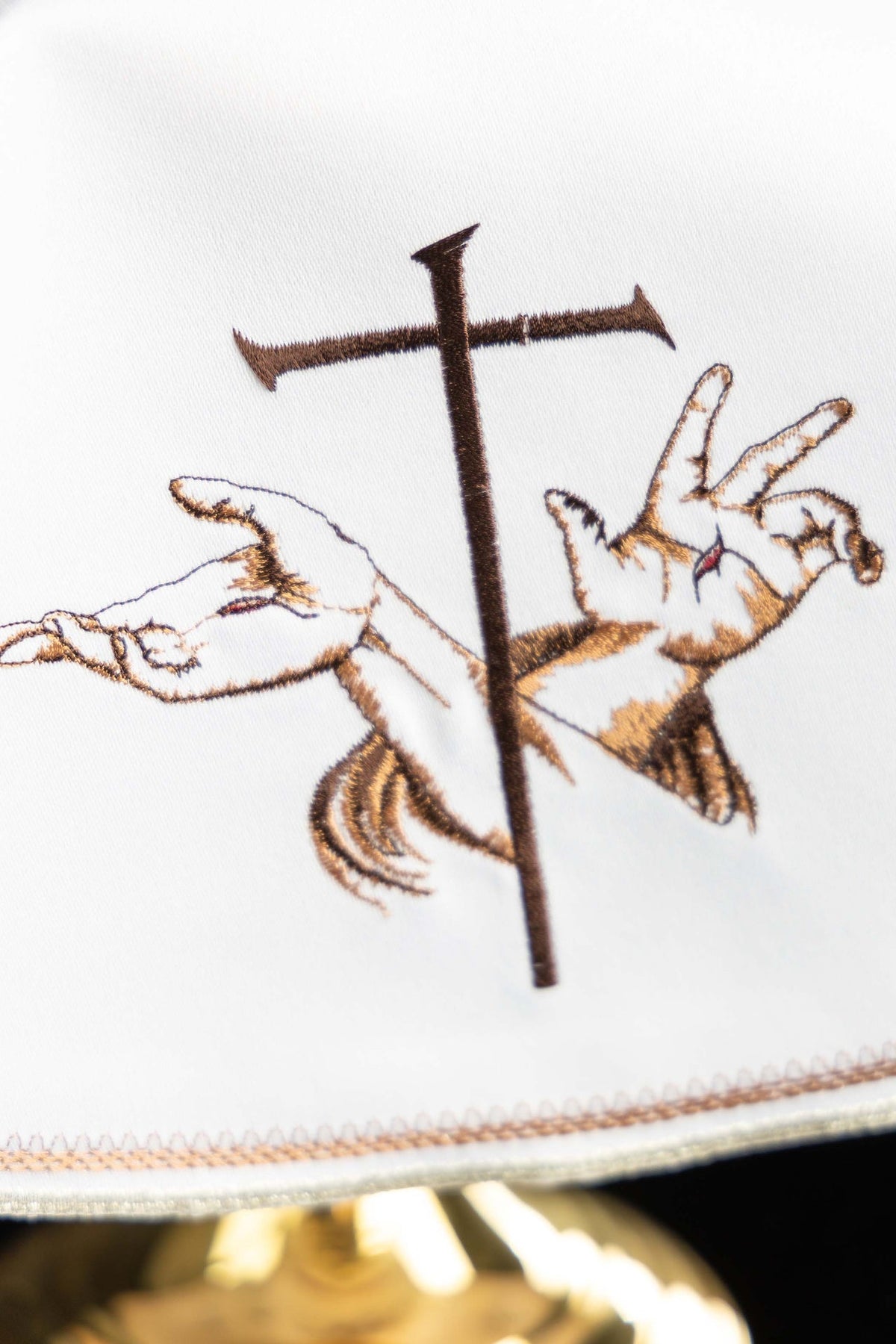 Ciborium veil detail showing Franciscan embroidery and stitched border