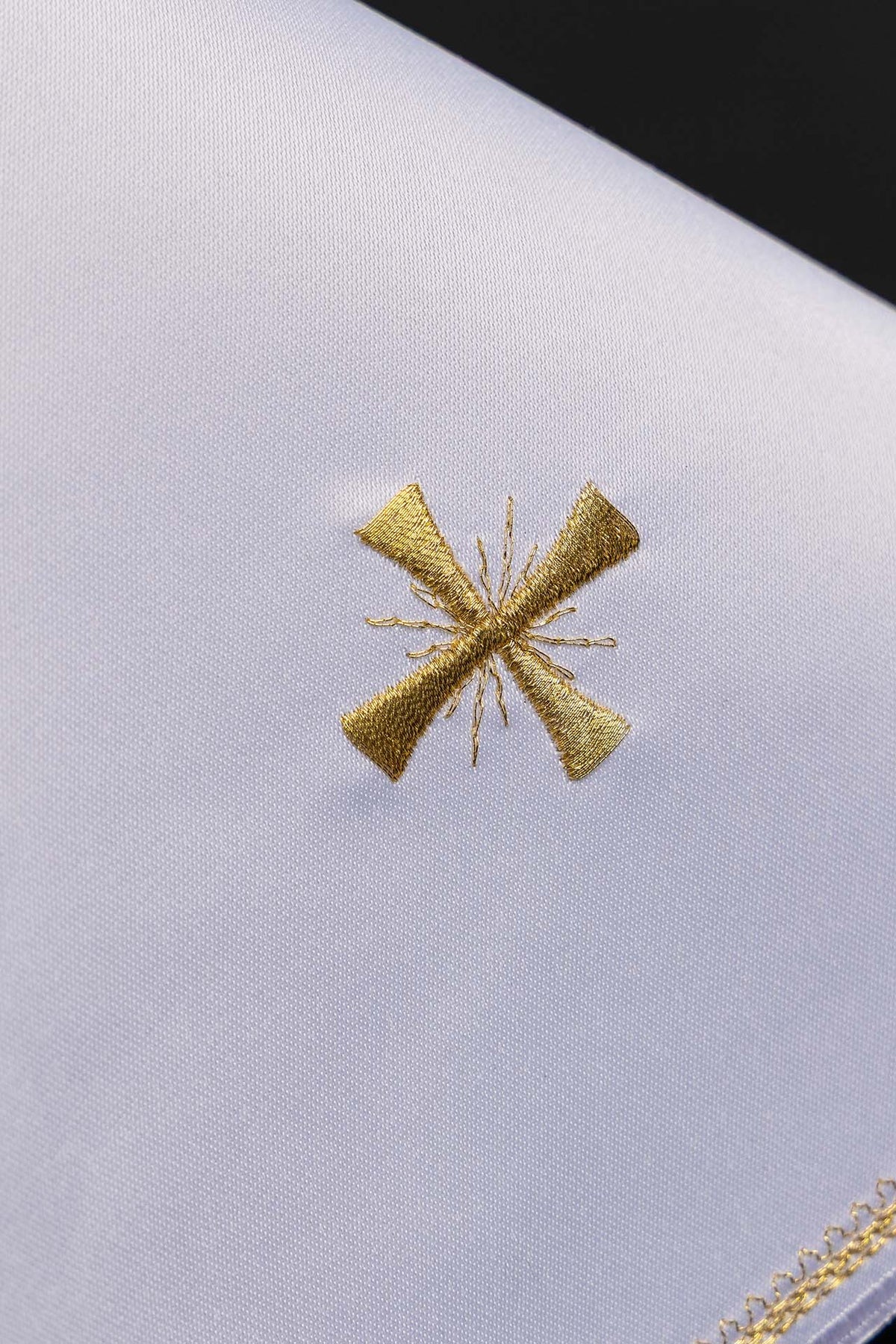 White ciborium veil detail with gold embroidered cross