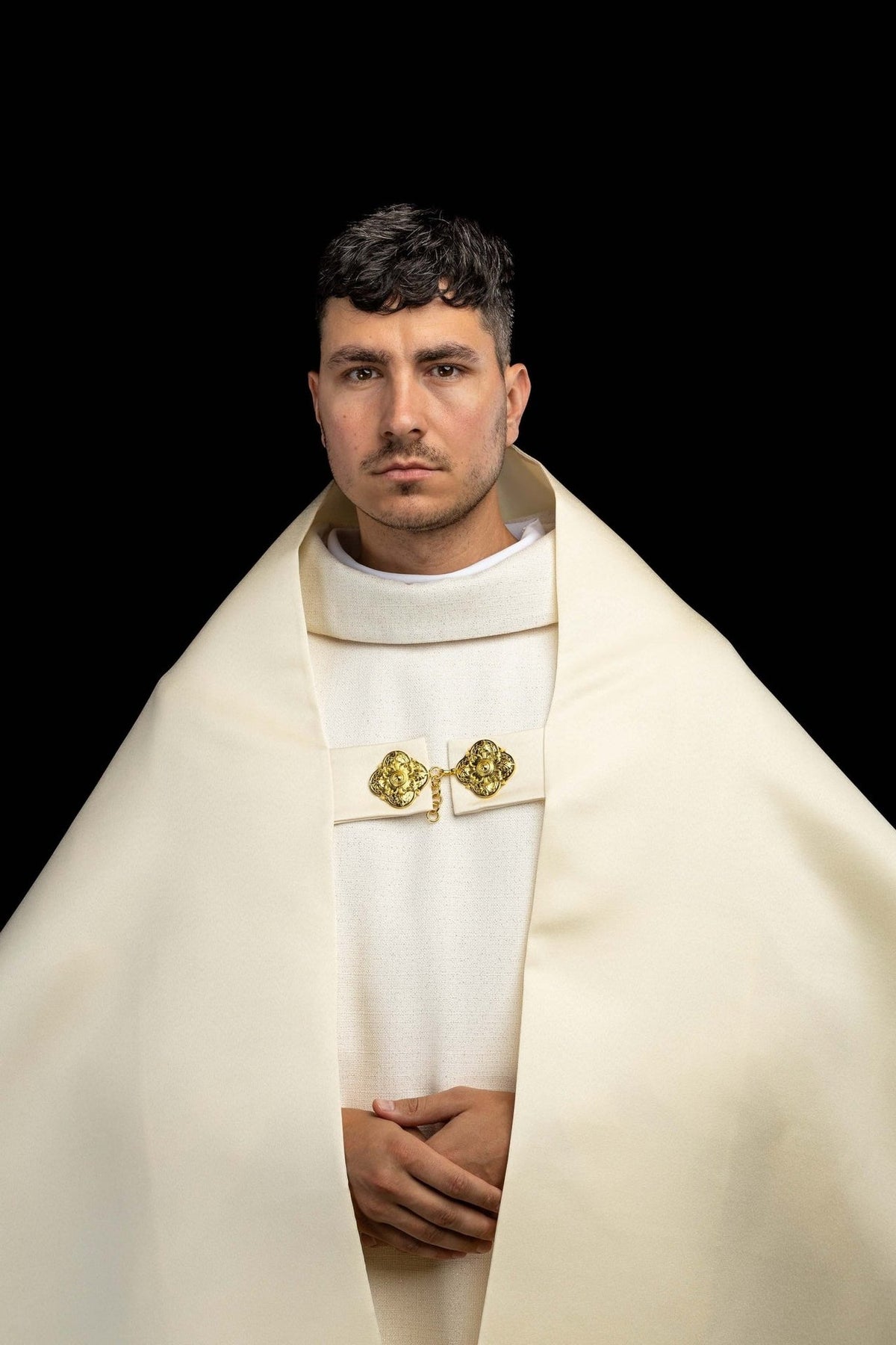 Humeral veil front view with plain ecru panels and gold clasp