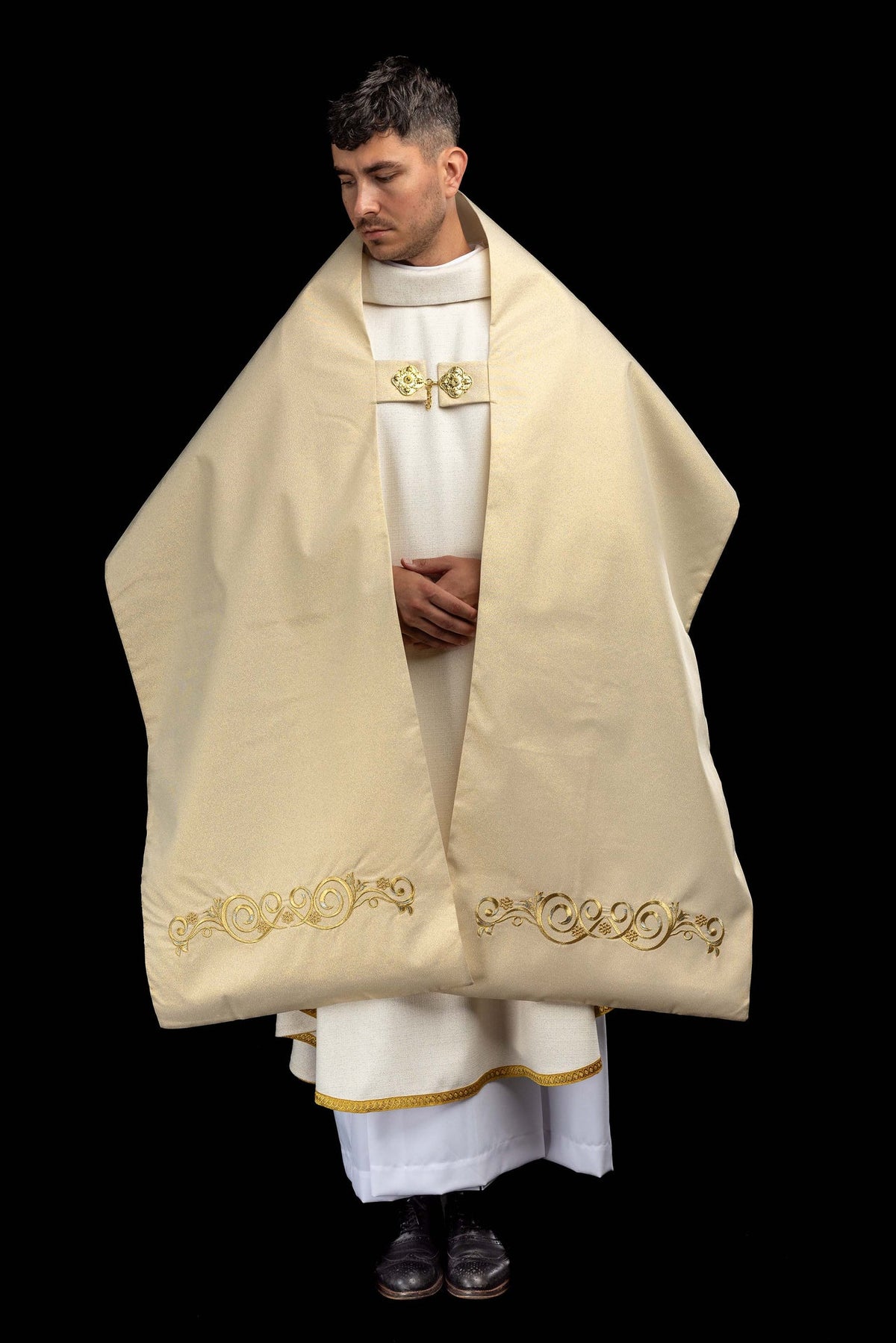 Humeral veil front view showing gold scrollwork embroidery along the lower edge