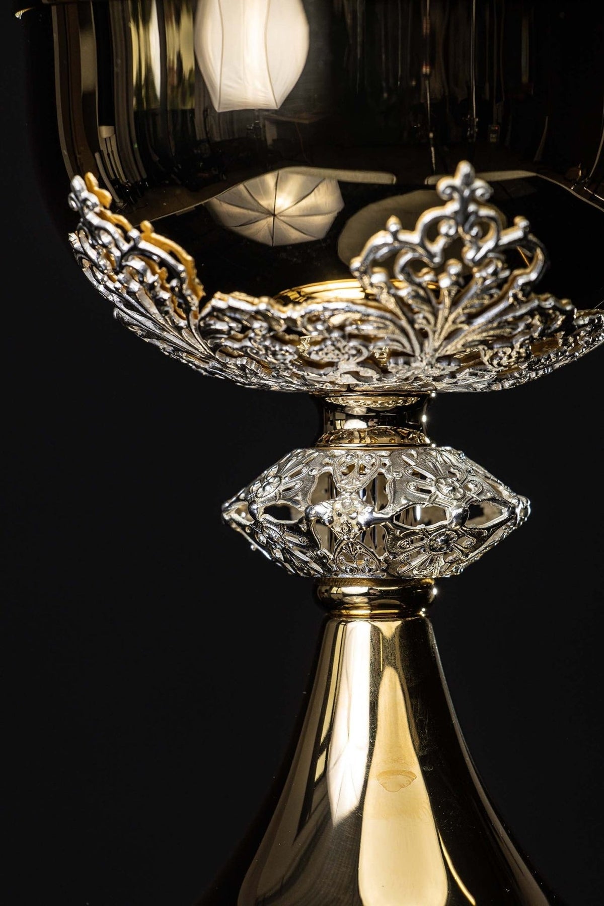 Ciborium close-up showing silver floral stem and openwork node