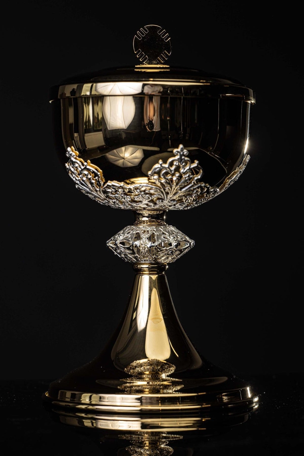 Gold-plated ciborium full view with silver decorations, lid and cross