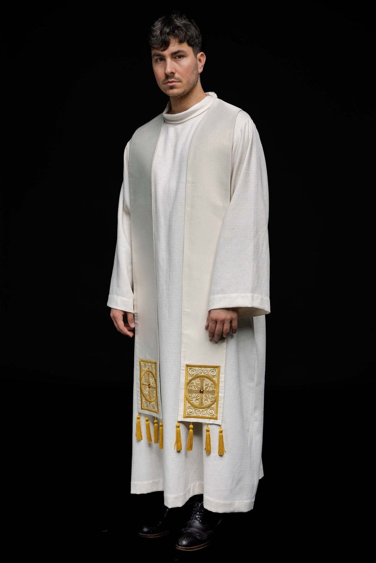 Priest stole worn in a white front view with gold embroidered crosses and tassels