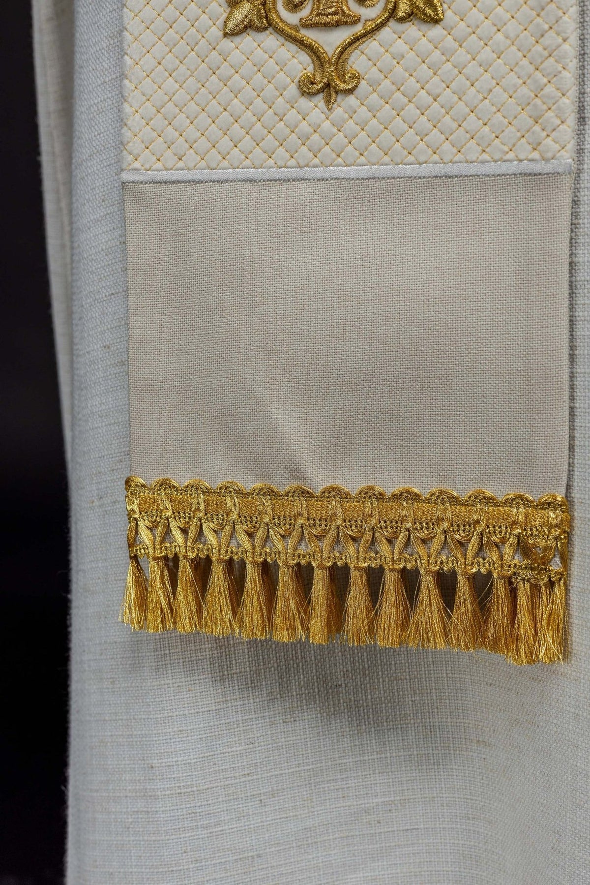 Ecru velvet stole close-up showing gold fringe trim