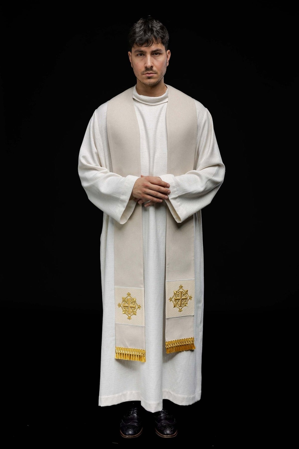 Ecru velvet stole worn front view with embroidered cross panels and gold fringe