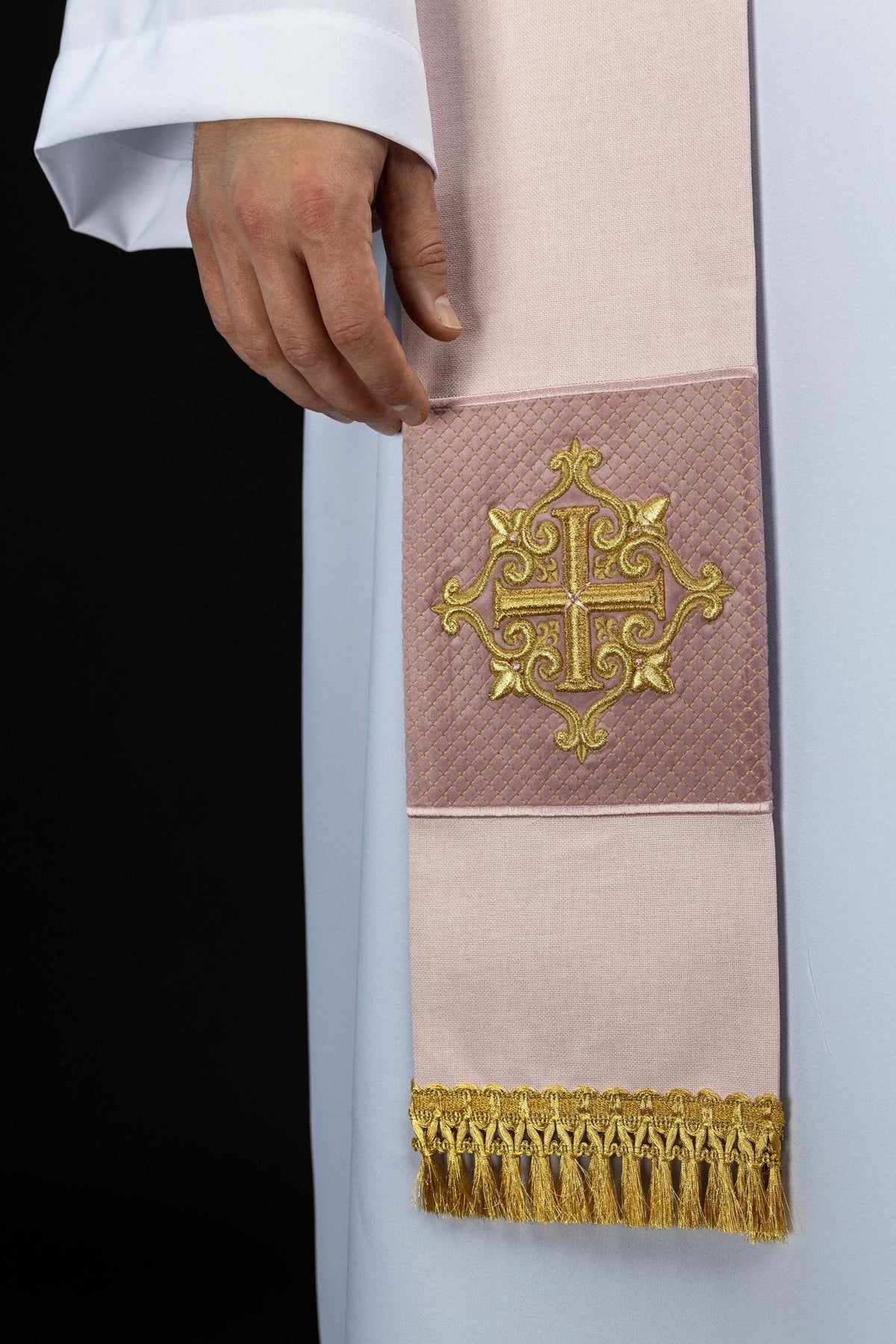 Rose velvet priest stole close-up showing embroidered gold cross and fringe