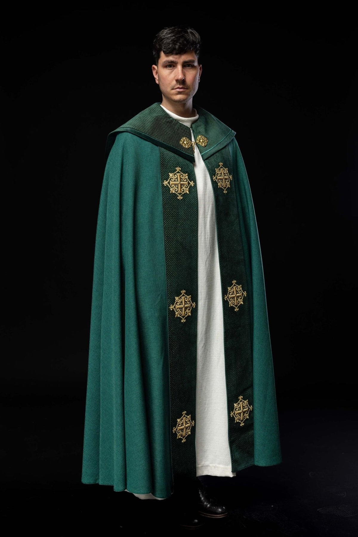 Green velvet cope, full front view with embroidered crosses on the orphrey