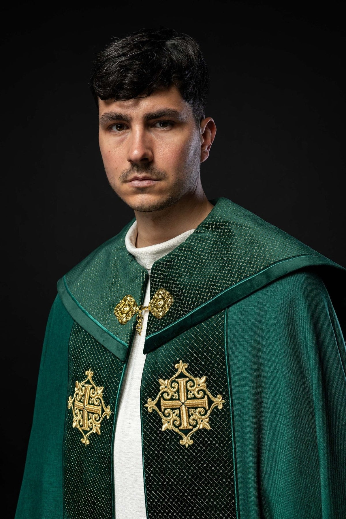 Green velvet cope, front close-up with gold cross embroidery and ornate clasp