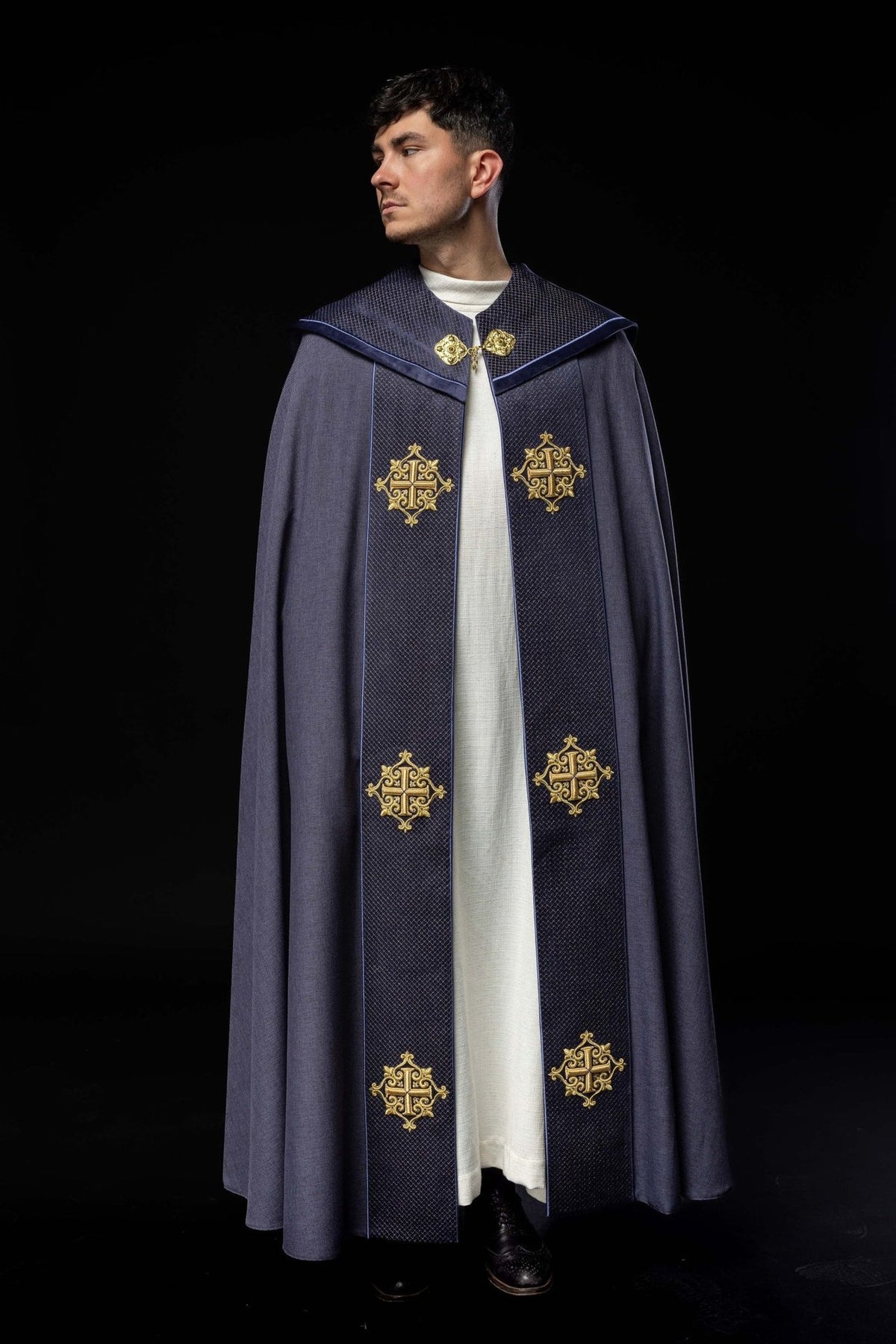 Liturgical cope front view with purple velvet orphrey and four embroidered crosses