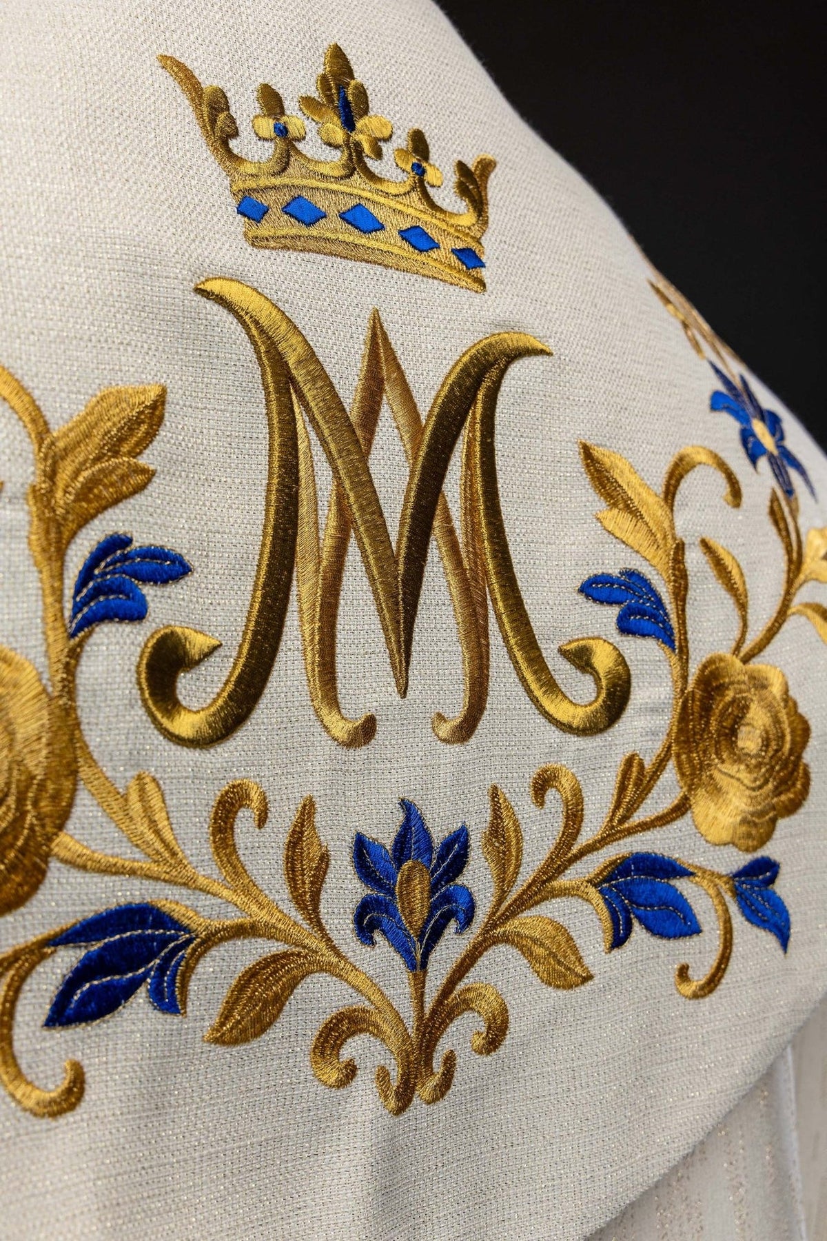 Ecru cope close-up of blue flowers and gold rose embroidery