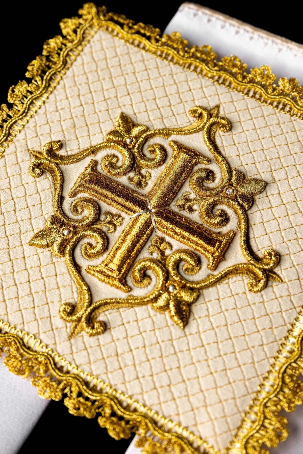 Altar linen set close-up showing gold embroidered cross and ornate trim